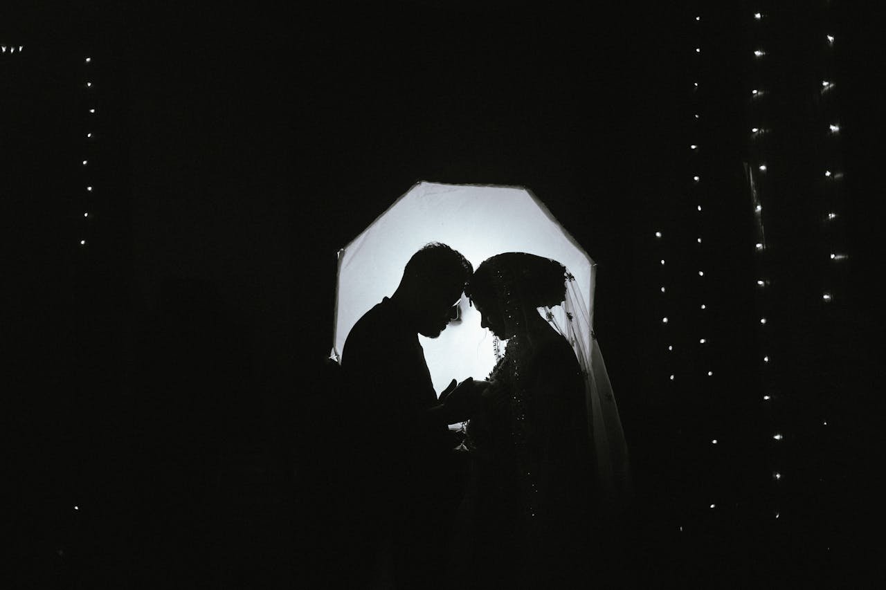 Silhouette of Bengali bride and groom during a romantic wedding ceremony in Bangladesh.